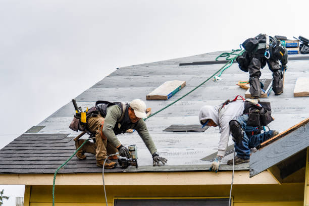 Professional Gutter Installation technician working in Lenox, MA